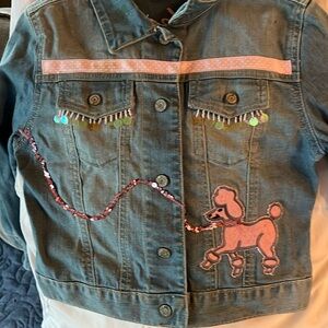 Girls bedazzled Jean jacket. Worn a few times. Like new condition.